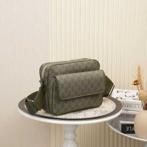 Alternative view of Batch 310... Style No. 795479 Dimensions 23x18x12 cm Gucci crossbody bag, black GG canvas with black leather trim, adjustable red and blue woven straps, cotton-linen lining, one internal zippered pocket, one external zippered pocket.