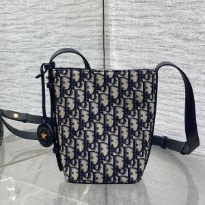 In Stock‼️ Dior's New Star Bucket Bag Collection The latest stunning handbags have arrived! Crafted from classic Oblique monogram fabric with exquisite workmanship, this adorable bucket bag design blends elegance with modern style. Its soft silhouette features a drawstring closure and removable long shoulder strap, combining practicality with beauty. Perfect for holiday outings—carry it with flair wherever you go!