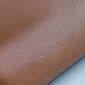 Alternative view of Batch 370...2025 Fall/Winter Collection. The Gucci Beatrix handbag is expertly crafted from black calf leather, featuring a shoulder strap adorned with the iconic horsebit detail that infuses casual silhouettes with the brand's essence. Gold-tone hardware adds a touch of refined luxury, while an interior zippered pocket ensures daily essentials are securely stored. Combining elegant design with practical functionality, it effortlessly accommodates everyday necessities.Black supple smooth calf leather Gold-tone hardware Black cotton-linen blend lining Shoulder strap with horsebit detail Interior: Zippered pocket Adjustable shoulder strap height: 26 cm - 33 cm; Length: 94 cm Model: 850546.Dimensions: 40 cm (W) x 36 cm (H) x 12 cm (D) Weight: Approx. 1 kg Color: Brown full leather Made in Italy