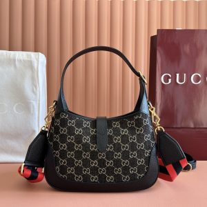 Alternative view of p810. 📣📣📣【Genuine Leather with 🌈 Full Boutique Packaging】Gucci UN3AG 1294 Product Details. The Gucci "Aria-Fashion Overture" collection reimagines classics with contemporary flair. The Jackie 1961 series debuts a soft-textured, flexible rectangular tote.Iconic designs feature all-over GG patterns and striped webbing details, while intricate accessories pay homage to Gucci's heritage. This compact handbag features black leather piping and the collection's signature gold-tone push-lock hardware. Black and ivory GG denim jacquard fabric. Black leather piping. Model: 678843.Dimensions: 28 x 19 x 4.5 cm. Colors: Black/Denim.