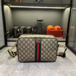 Batch 300...G G Ophidia Collection masterfully blends beige and brown tones, pairing classic silhouettes with innovative functionality in exceptionally soft fabrics. This crossbody bag features GG monogrammed coated fabric, adorned with double G insignia and woven strap details.Beige and dark brown GG interlocking pattern coated fabric, dark brown leather trim, gold-tone hardware, dark green linen-cotton blend lining. Model: 834468. Dimensions: 28.5 x 18 x 7.5 cm.