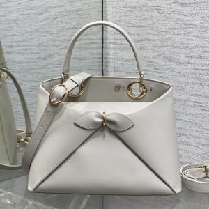 Alternative view of Light Gold In Stock‼️ Dior 2026's newest bow handbag, featuring a signature bow design integrated into the collection. The bow no longer carries a sweet, girlish vibe—its newly designed silhouette and shape, paired with versatile color options, strike the perfect balance between sweet and edgy. Size: 28*10*22