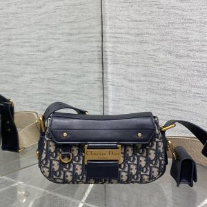 In stock‼Spring/Summer New Street Chic Collection—flatters every wearer. A perfect evolution of punk from the Pirate Lord era, this is destined to be a smash hit. Exudes cool and edgy vibes with distressed metal lettering tags and classic Oblique monogram fabric. Features adjustable embroidered lettering woven wide shoulder straps. Retro style always leads the fashion frontier. Includes Air earphone pouch. A must-have for avant-garde trendsetters. Size: 24*5*12.5cm