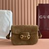 Batch 340... Fall/Winter 2025 Collection. This shoulder bag reinterprets the brand's equestrian-inspired design, featuring light gold-tone details and suede material, complemented by double rings and elongated hardware, adding to the Gucci Horsebit 1955 collection.Brown suede with gold-tone hardware. Brown leather lining. Horsebit clasp. Interior: One open pocket. Three-compartment design. Adjustable shoulder strap. Height: 28 cm – 50 cm; Length: 71 cm – 114 cm. Model: 847063.Dimensions: 26 cm (W) x 17.5 cm (H) x 10 cm (D) Weight: Approx. 0.85 kg Color: Brown suede/natural leather.