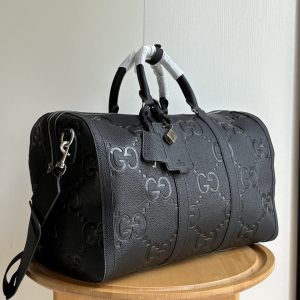 Alternative view of Batch 400... Style No.: 648085 Black Large G Dimensions: 45/27/23 Ophidia Classic Travel Tote Features padded shoulder strap, adjustable webbing, and key lock 🔐 Incredibly spacious interior The ultimate choice for travel