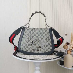 Batch 390... Style No.: 721172 Blue Dimensions: 29x22x7cm Blondie Series Tote Bag. This shoulder bag features studded handles, beige and ebony GG canvas, gold-tone hardware, and a circular interlocking double G. Includes two interchangeable shoulder straps.