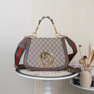 Batch 390... Style No.: 721172 Color: Coffee Dimensions: 29x22x7cm Blondie Series Tote Bag. This shoulder bag features studded handles, beige and ebony GG canvas, gold-tone hardware, and a circular interlocking double G. Includes two interchangeable shoulder straps.