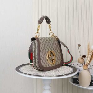 Alternative view of Batch 390... Style No.: 721172 Color: Coffee Dimensions: 29x22x7cm Blondie Series Tote Bag. This shoulder bag features studded handles, beige and ebony GG canvas, gold-tone hardware, and a circular interlocking double G. Includes two interchangeable shoulder straps.