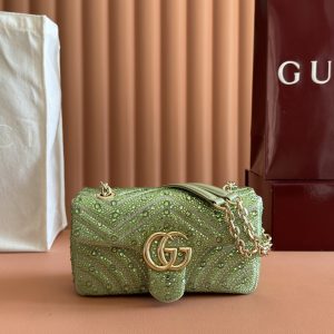 p800💋💋💋【Authentic Retail Packaging】The iconic GG Marmont collection masterfully blends the classic double G motif with a light gold-tone faceted chain strap, crafting a fashion-forward handbag design.Crafted in light green nubuck leather and adorned with crystal embellishments, this shoulder bag exudes refined elegance. Light green nubuck leather with crystal quilting Light gold-tone hardware Green viscose lining Double G interior 1 open pocket Slide chain strap doubles as shoulder strap (55cm height) Spring-loaded clasp closure Model: 837280Dimensions: 22 cm (W) x 12.5 cm (H) x 6 cm (D) Weight: Approx. 0.55 kg Color: Green/Crystal Made in Italy
