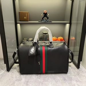 Batch 380... The G G Savoy collection masterfully blends beige and dark brown hues with a classic silhouette, crafted from exceptionally soft fabrics. This travel bag features GG monogrammed coated fabric, adorned with double G insignia and woven strap details.Beige and dark brown GG interlocking pattern coated fabric, dark brown leather piping, gold-tone hardware, green linen-cotton blend lining. Model: 834460. Dimensions: 44x 29x 25cm