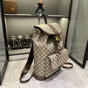 Alternative view of Batch 380...G G Ophidia Collection masterfully blends beige and dark brown hues, pairing classic silhouettes with innovative functionality in exceptionally soft-touch fabrics. This backpack features GG monogrammed coated fabric, meticulously embellished with double G logos and woven strap details.Beige and dark brown GG interlocking pattern coated fabric Dark brown leather trim Gold-tone hardware Dark green linen-cotton blend lining Model: 839109 Dimensions: 28 x 40 x 12 cm