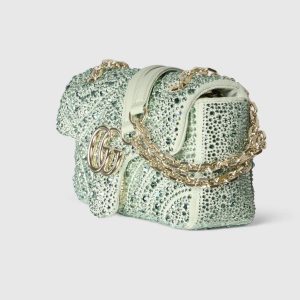Alternative view of The iconic GG Marmont collection masterfully blends the classic double G motif with light gold-tone faceted chain straps, crafting a fashion-forward handbag design.Crafted from light green nubuck leather and adorned with crystal embellishments, this shoulder bag exudes refined elegance. Light green nubuck leather with crystal quilting Light gold-tone hardware Green viscose lining Double G interior: 1 open pocket Slide chain strap doubles as shoulder strap (55cm height) Spring-loaded clasp closure Style: 837280.Dimensions: 22 cm (W) x 12.5 cm (H) x 6 cm (D) Weight: Approx. 0.55 kg Color: Light Green/Crystal Made in Italy