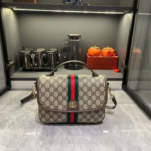 Batch 310...GG Ophidia Collection presents a fresh silhouette and functionality, expertly crafted in signature beige and brown colorways to create a soft-textured, revitalized bag.Beige and dark brown GG canvas, brown leather trim, light gold-tone hardware, green cotton lining. Model: 836842. Dimensions: 24 x 17.5 x 11.5 cm