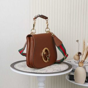 Alternative view of Batch 400... Style No.: 721172 Brown leather Dimensions: 29x22x7cm Blondie Series Tote Bag. This shoulder bag features studded handles, beige and ebony GG canvas, gold-tone hardware, and a circular interlocking double G. Includes two interchangeable shoulder straps.