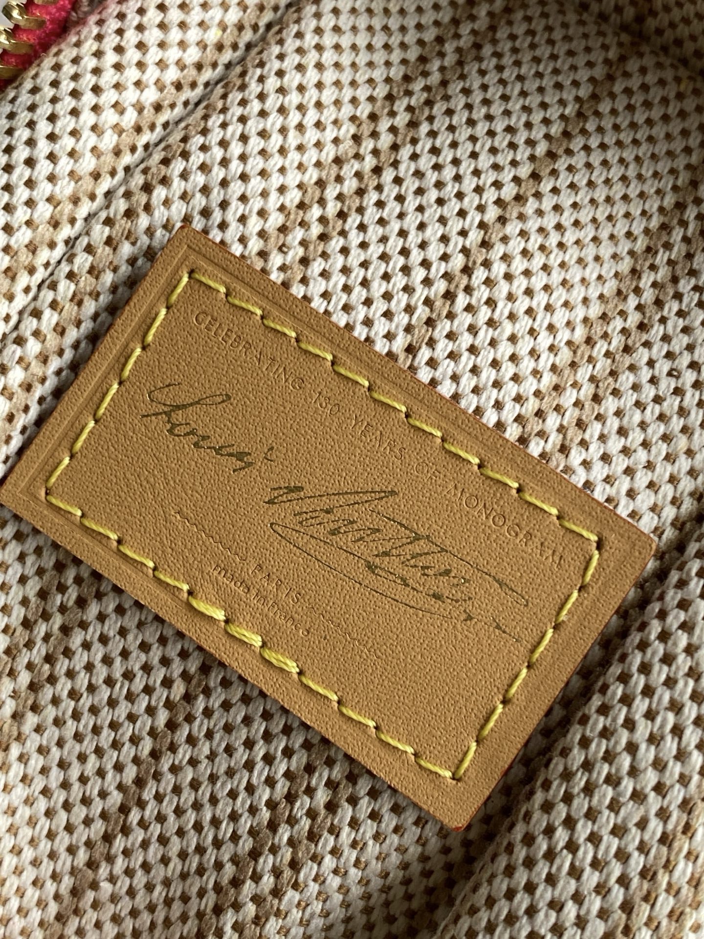 p750 Color MONOGRAM Original Black Pattern Series commemorates the iconic Louis Vuitton Beaton Monogram's 130th anniversary, showcasing timeless design through your MM Monogram Original Canvas side trunk. Sensual gold hardware draws inspiration from the trunk's signature frame and lock mechanism. Special leather address tags and iconic interior labels appear exclusively in the Monogram Anniversary collection.Dimensions: 23.5 x 16 x 8.5 cm (L x H x W). Capacity: 6.7-inch smartphone, earphones, coated canvas G-Power battery, keys, lipstick.Cowhide leather trim. Shoulder strap: Detachable, adjustable length. Striped lining (when worn as shoulder bag). Minimum shoulder strap length: 45.0 cm. Gold-tone hardware. Zipper closure with lock (when shoulder strap is attached). Maximum shoulder strap length: 55.0 cm. Detachable commemorative charm. - Image 9