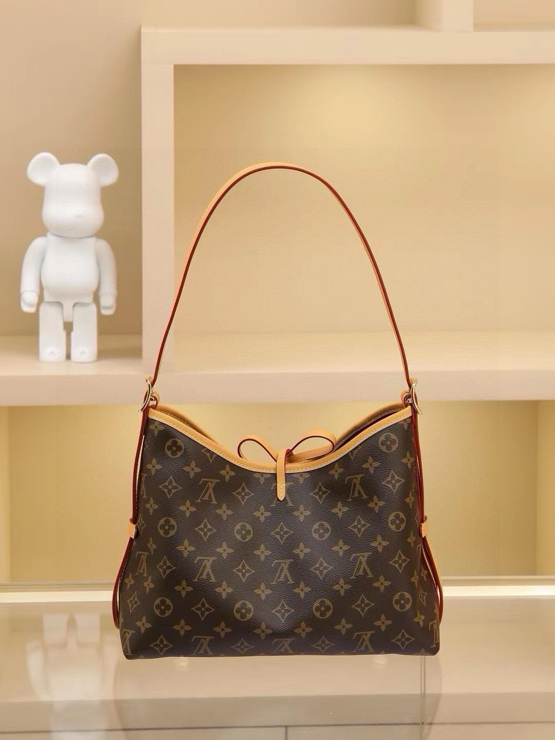 CarryAll Medium Handbag, crafted from Monogram canvas with leather trim for a form-fitting silhouette. Generous interior space includes a zippered pocket, while a detachable zippered clutch adds functional versatility. Buckle-adjustable handle length. Dimensions: 39×30×15cm - Image 2