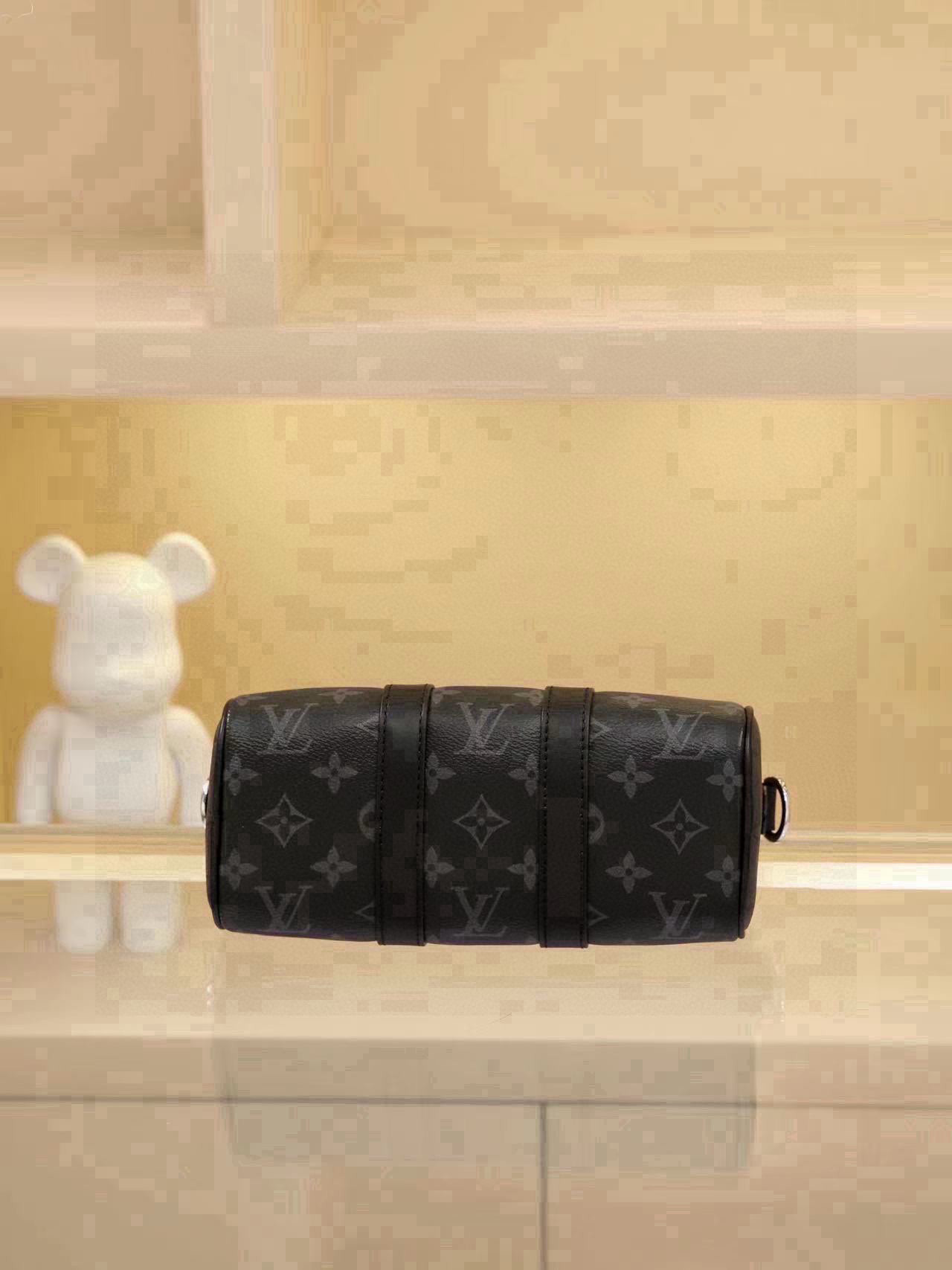 All-Steel Hardware Speedy Pillow Bag Collection This Keepall XS handbag is now available. Perfect for women, yet unisex in design. The black monogram pattern exudes sophistication. Most importantly, the shoulder strap is adjustable. Features: Monogram coated canvas, leather trims, fabric lining, zipper closure, removable and adjustable shoulder strap. Dimensions: 21 × 12 × 9 cm - Image 4