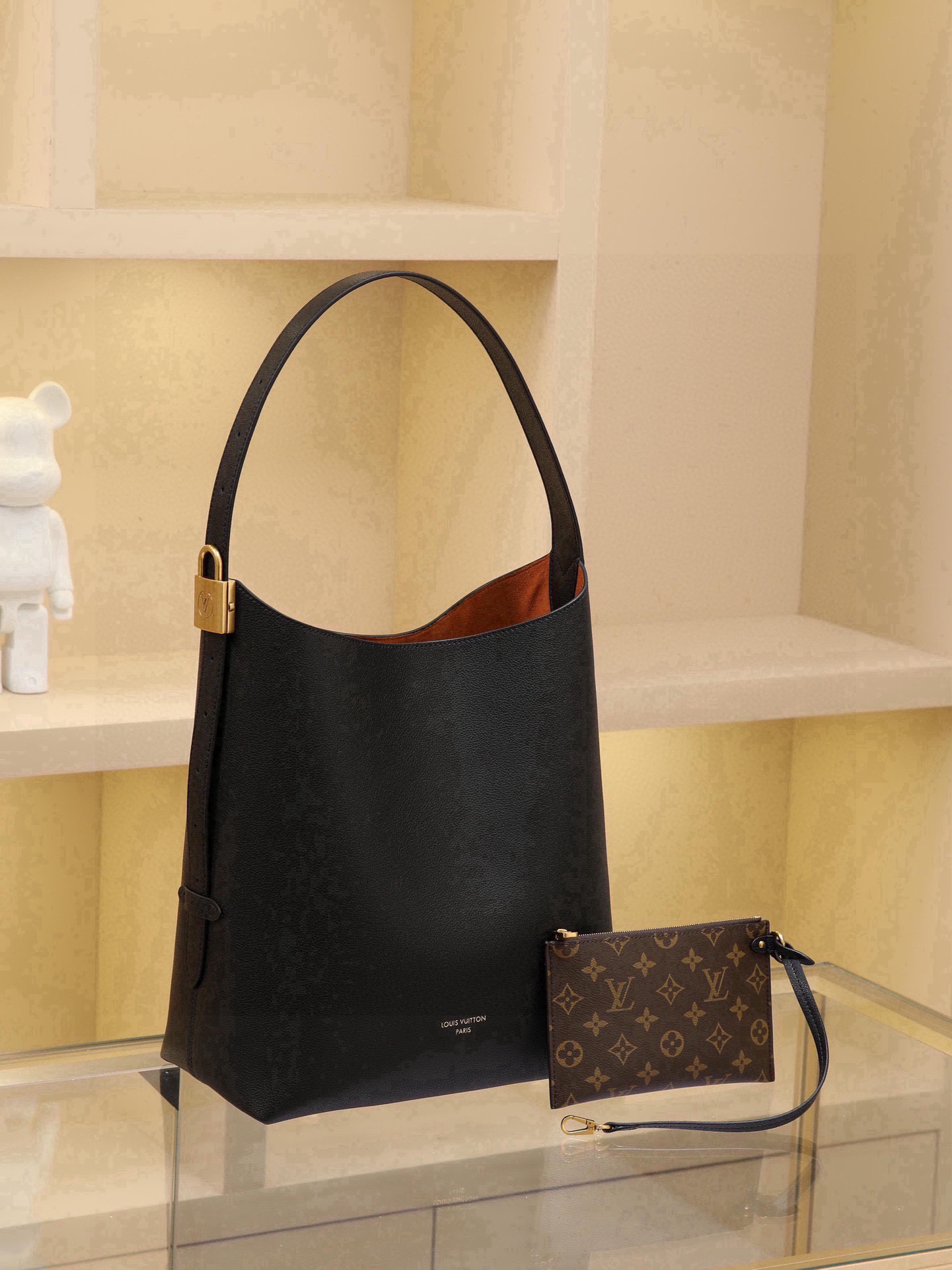 Low Key Hobo Medium Handbag Crafted from supple cowhide leather with clean, understated lines, this piece features a suede lining that exudes contemporary flair, showcasing the brand's masterful craftsmanship. An adjustable shoulder strap is accented with a signature padlock, while ample interior space easily accommodates daily essentials like a laptop. Dimensions: 31.0 x 35.0 x 18.0 cm - Image 2