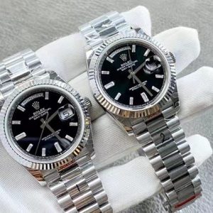 Alternative view of Rolex Day-Date series watch, powered by the 2836 movement. Exclusive real-life photos—truly substantial in the hand. Crystal-clear glass, authentic date display, hands with central pivots, and a highly textured bezel. Ready to wear right out of the box with exceptional feel. Say goodbye to flimsy watches forever. Weighted version, just as substantial as the boutique model! 40mm diameter, crafted by GM Factory.