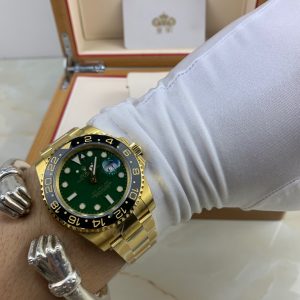 Royal Authentic  Rolex GMT-Master II in Solid Gold with Green Dial