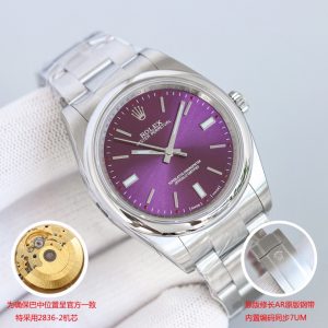 Alternative view of N+AR Redefined, Peak Performance! Rolex Oyster Perpetual Series 114300 39mm 【Eight Major Upgrades】 🎮XF3 1. Sapphire crystal features a 125-point anti-counterfeit mark at 6 o'clock using the latest technology, precisely positioned in the crystal's middle layer—matching the genuine piece! Requires close inspection to distinguish from the original.2. The case and bezel feature a precision-ground finish using 904L steel, with uniform internal engraving codes and perfectly aligned component assembly! 3. Dial diameter measures 39mm, with thickness matching the genuine model at 11.7mm. 4.NR Factory's steel bracelet meticulously replicates every detail—the inner side of the 12 o'clock link interface bears the official model code 114300. 5. The brushed steel bracelet from N+AR Factory represents the most precise craftsmanship currently available. Combined with its exquisite flathead screws and the brushed finish of 904L stainless steel, it offers an identical wearing experience to the genuine article.  6. The meticulously polished clasp structure replicates the original's internal mechanism, achieving a flawless folding action. The interior shows no imperfections whatsoever! 7. The caseback's gearing faithfully reproduces the original's authentic tooth pattern. Seiko's precision brushing technique outshines all other versions on the market! 8. The dial features exquisite polishing and Swiss-imported luminous powder densely applied for an ultra-vibrant ice-blue glow at night! Identical to the original! 🎮 After examining the 124300, revisit this 114300—Rolex's inaugural color dial series. It also features the most standard Asian-sized 39mm case. When Rolex first updated this size, the 39mm model sold out immediately, especially the gray version and later white/black full-luminous dial variants! Its exceptional yet understated color scheme remains highly favored by successful business professionals!This Oyster Perpetual, meticulously crafted by N+AR to match the original quality, showcases attention to detail visible to the naked eye. To align the crown's positioning with the authentic model, it features the original Seagull 2836-2 gold-plated movement. Watch enthusiasts know the ETA 2836-2 movement has long been recognized for its stability (daily deviation under 0.3 seconds) and exceptional value!Additionally, the manufacturer has meticulously replicated the 114300 model's lug-to-bracelet transition!Attention to detail extends to both visible and hidden elements! The Oyster Perpetual-exclusive brushed steel bracelet features an internally stamped logo shape, making it the market's only authentic Oyster bracelet [slim profile]. The clasp's internal code remains true to the AR original bracelet's 7UM specification, with all colors perfectly matching the original color chart! Oyster Swiss Super Ice Blue Luminous!If you're truly unsure which to choose, we strongly recommend this flawless 114300! Look for the NR quality seal: one watch, one certificate, one Rolex-branded velvet pouch. [NR: Born for Value] 🎮 Sanjie Exquisite recommends this men's mechanical watch. SJ meticulously crafts ultra-realistic product photography.