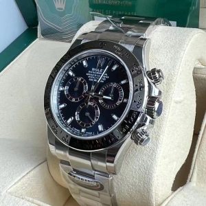 Alternative view of Better(BT) 4130 Daytona: Superior Manufacturer, Superior Quality, Truly Royal! The ultimate timepiece, the finest Daytona BT (Better) factory-made replica—guaranteed premium craftsmanship. Welcome to appreciate! Better Factory 2022 Latest Daytona Specifications: Model: 116500 Dimensions: 40mm × 12.4mm Functions: Hours, Minutes, Seconds, Chronograph Movement: 4130 Power Reserve: Over 48 hours Crystal: Sapphire Dial: White, Black Material: 904L Stainless Steel Strap: AR FactoryHours, Minutes, Seconds, Chronograph Display Movement: 4130 Power Reserve: Over 48 hours Crystal: Sapphire Dial: White Dial, Black Dial Material: 904L Stainless Steel Bracelet: AR Factory Steel Bracelet Bezel: Ceramic Bezel with Platinum-Plated Film Luminescence: Swiss Luminous Paint Water Resistance: 100 meters Nine Key Highlights of the Rolex Daytona by BT Factory (Better Factory):    1. The BT Factory Daytona 4130 movement watch thickness matches the latest 2022 model at 12.4mm. Older versions were 12.4mm. Other market versions use 7750 fake bridge movements, achieving reduced thickness by flattening the pin bar. Stability is extremely poor, failing to match the genuine article.    2. Features the 4130 movement (originally from N Dandong Factory), with engraved and electroplated fonts on the back plate for enhanced brightness.    3. Steel bracelet sourced from the original AR Factory. Additionally, the clasp has been upgraded with improved proportions and dimensions.    4. Case crafted by N Factory based on the latest 2022 model, featuring updated polishing on the case back, enhanced gloss finish, and refined bezel edge curvature.    5. Hands upgraded by Buff Factory: all three small seconds hands and the large seconds hand are individually custom-made with solid ferrules, featuring mushroom-shaped rounded tips. 6. Cerachrom bezel further upgraded with platinum-plated lettering to prevent discoloration, along with updated font thickness.    7. The dial replicates the 2022 white version, using Swiss ink blended with Korean ceramic polishing to achieve a rich, pure milky white with no color difference from the original. This eliminates the "dead white" tint that previously appeared blackish in the market. 8. Each hour marker is individually CNC-engraved and hand-polished at the edges. The luminous material uses Swiss phosphorescent powder, matching the genuine version perfectly. The final effect delivers the closest luminous visual to the original in the market.    9. The crystal employs fully transparent sapphire glass with no visible edges. Currently, most market crystals exhibit a thick, rounded edge appearance. Only BT Factory's craftsmanship matches the genuine article's details. Better Factory is a watchmaker with 30 years of manufacturing experience. Leveraging extensive resources, it possesses substantial technical expertise and industry connections. Watch enthusiasts are welcome to compare our products with originals and share valuable feedback. Thank you for your support!