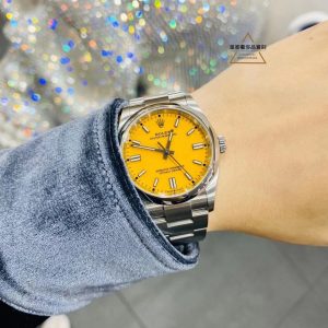 Nice, huh? A Rolex with a yellow dial, plus black, red, green, light blue, dark blue, and silver.