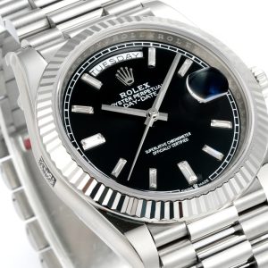 Alternative view of PPM Mods Weighted DD - Ceiling-Level 'Rolex DD Day-Date' PPM's replica redefines the weighted DD version, featuring genuine original molds for strap color, dial color, watch weight, and thickness. The strap incorporates ceramic tubes compatible with authentic models—this is not a compromised replica, but a comprehensive leap in materials and craftsmanship!Rejecting "market-grade" imitations, every gram of weight (precise 209g-212g) and every millimeter of thickness fights for the dignity of the original. Bracelet: Authentic 3mm thickness Weight: Approx. 107g (non-extended) 🈚 Ceramic tube version ±1-2g.Case: Original thickness: 12.3mm (non-thickened) Weight: Original 3255: 102g; Optional 2836: ±1g. Full series total weight: 209g-212g. ⚠️"Excludes diamond bezel models." Authentic thickness achieved through monolithic forging of high-density aerospace-grade military alloy, hardness rivaling 18K gold!Exclusive vacuum ion-plated gold technology delivers a luster infinitely close to 18K gold's signature warm texture, offering scratch resistance and durability. Precisely replicates every link's form, thickness, and curvature of the genuine strap. Dial: Features original 3D ink, matching the top-tier dial craftsmanship of the factory. Hands are sharp, hour markers are full, and luminescence is uniform.Movement options: Premium Edition 2836 or 3255 integrated movement (±72-hour power reserve) available for your selection!