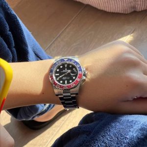 Alternative view of Summer calls for refreshing colors—the Rolex GMT-Master II Coca-Cola bezel.